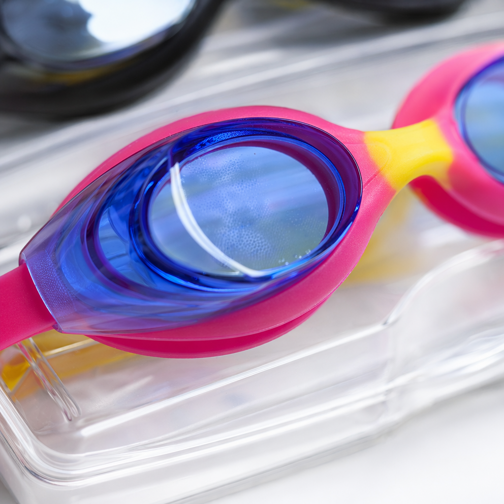 Three pairs of colored swimming goggles in blue, yellow, black, pink and yellow, with protective film and transparent storage box Application Scenario
