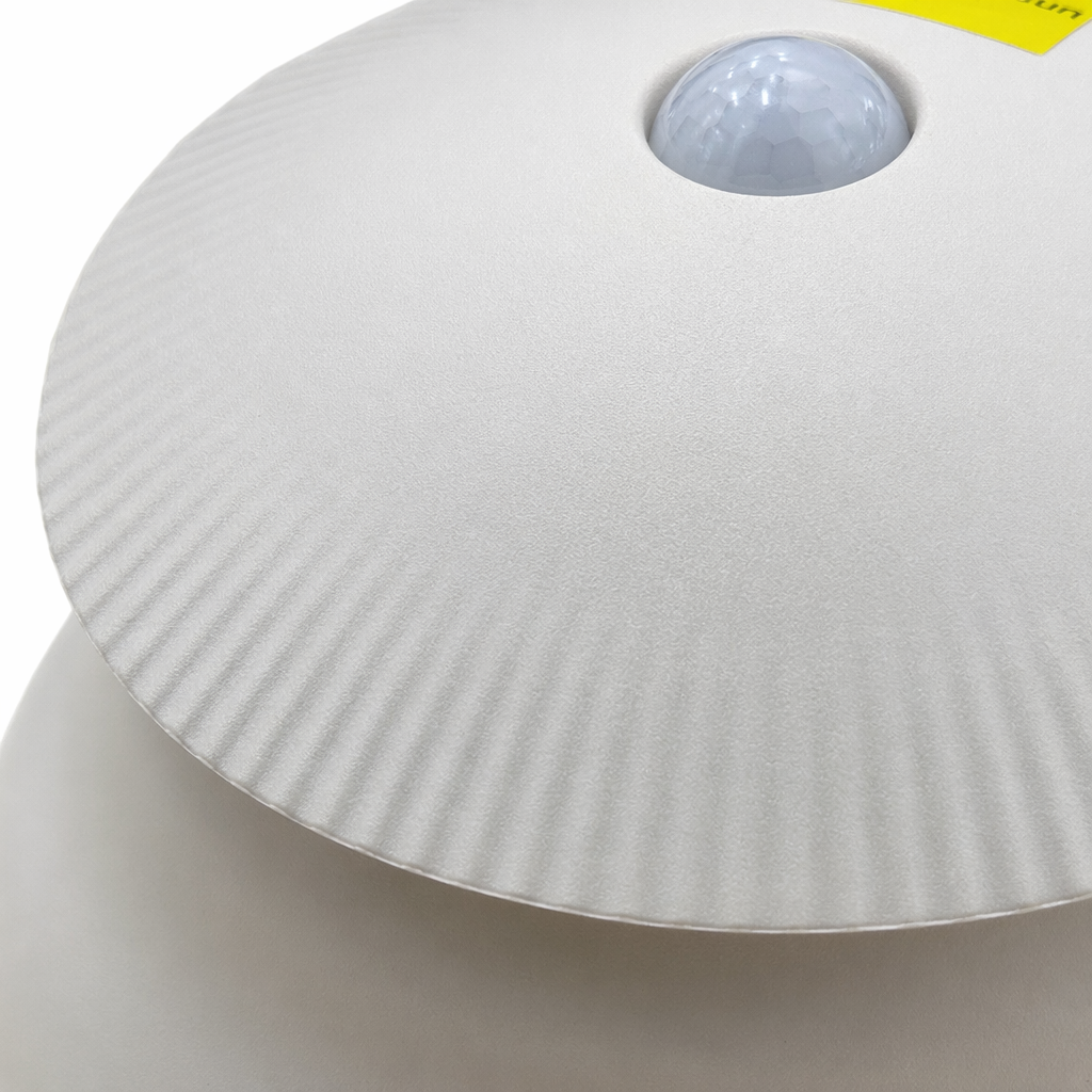 A circular device with a beige textured cover Application Scenario