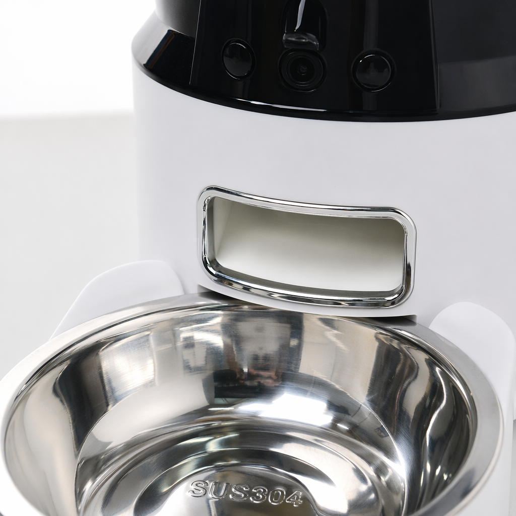 A white automatic feeder with a black base and a stainless steel hanging food bowl Application Scenario