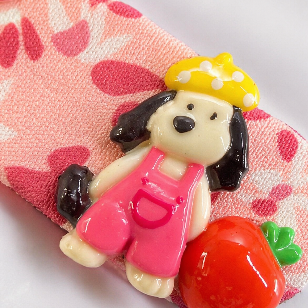 A pink flower-patterned hairpin, a cartoon dog wearing a yellow polka dot hat, pink overalls and red strawberry decorations Application Scenario