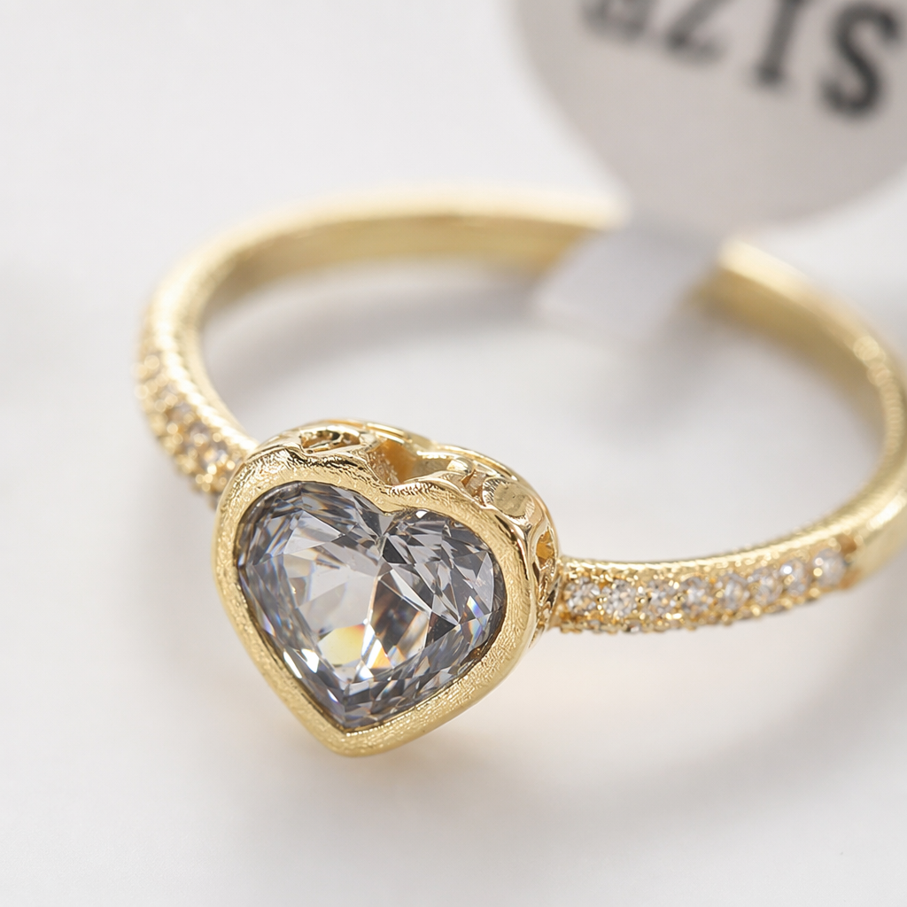 A golden heart-shaped ring set with a purple crystal band, small diamonds on both sides, and a SIZE 9 label Application Scenario