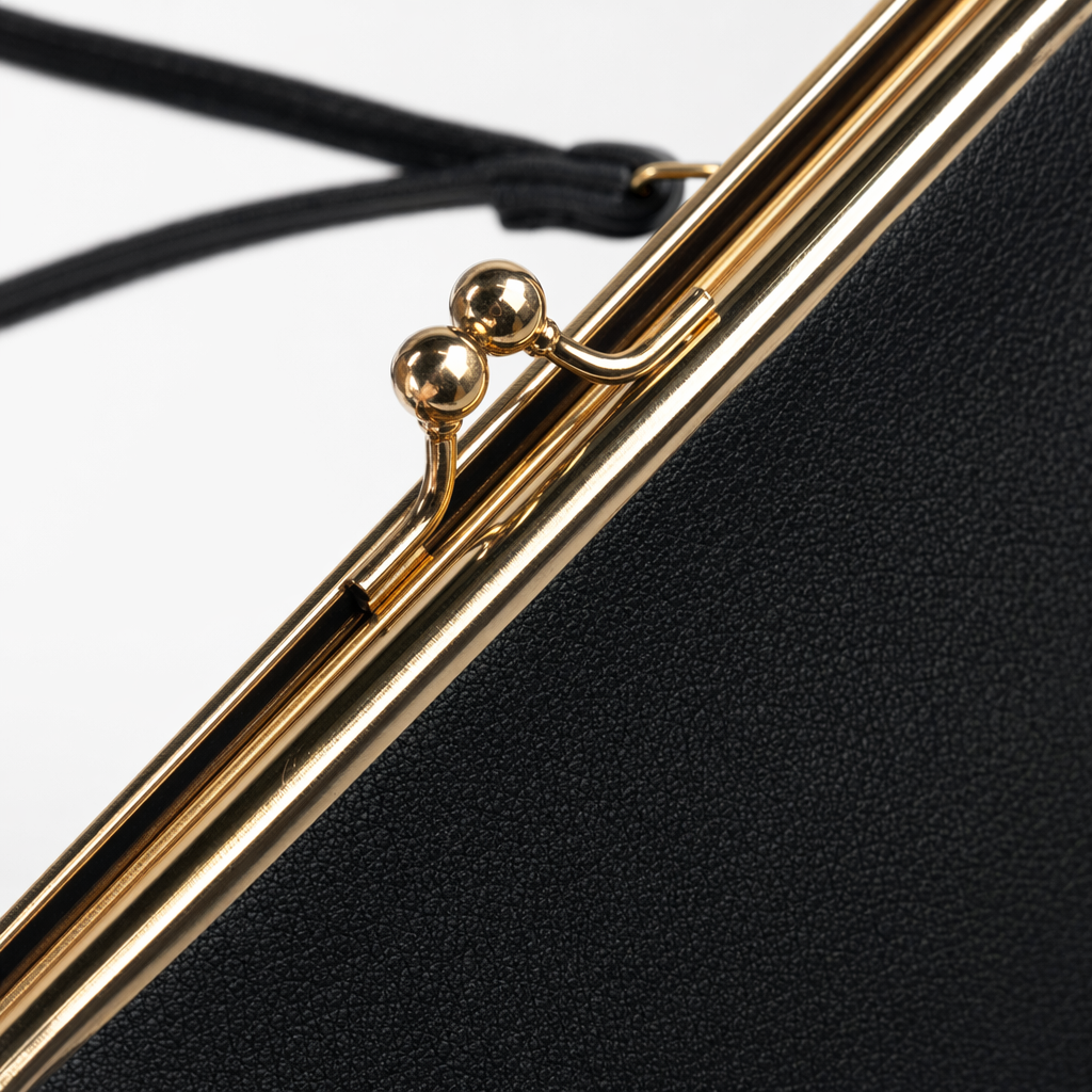 A black clutch with a golden metal buckle and a black wristband Application Scenario