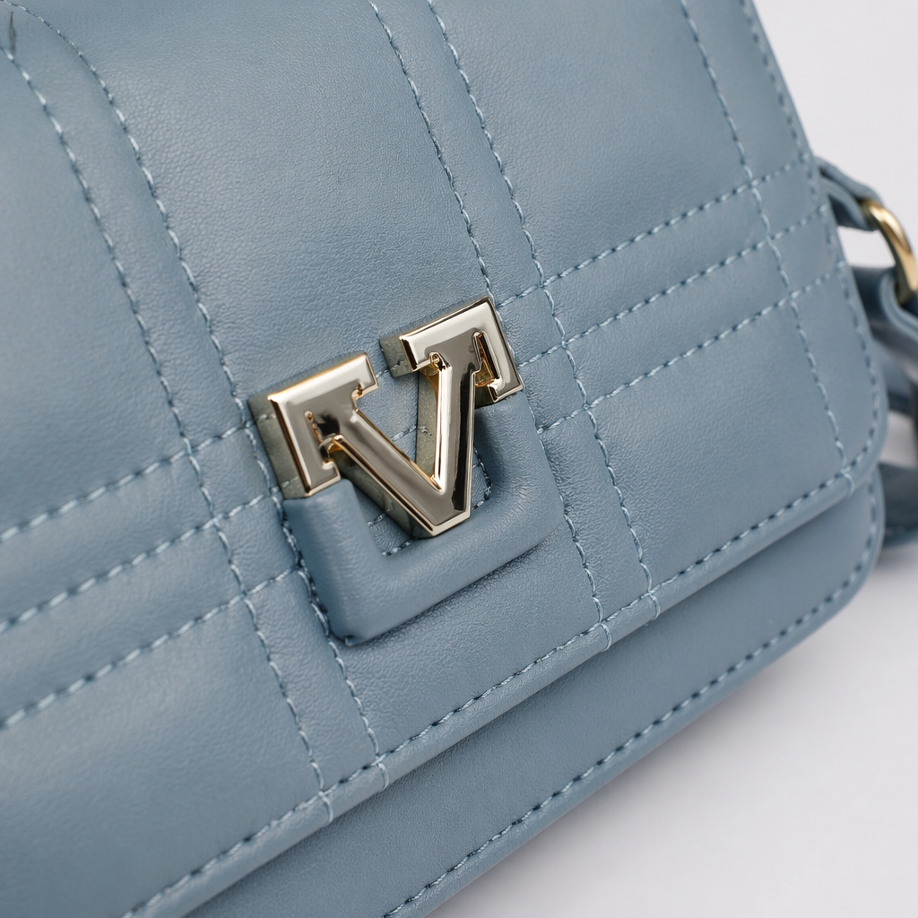 A light blue diamond-patterned small square bag with a detachable shoulder strap featuring golden V-shaped fasteners Application Scenario
