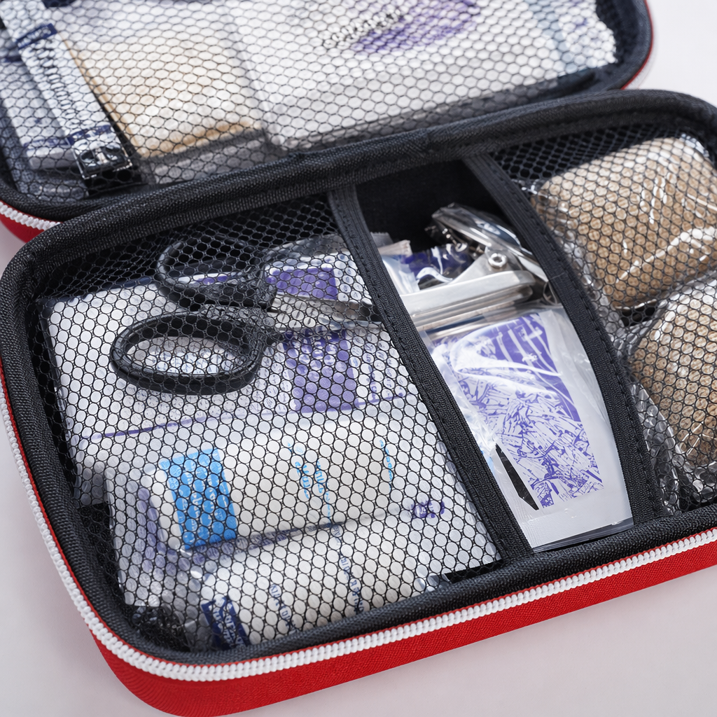 A portable outdoor home medical storage bag for first aid kits separated by black mesh bags Application Scenario