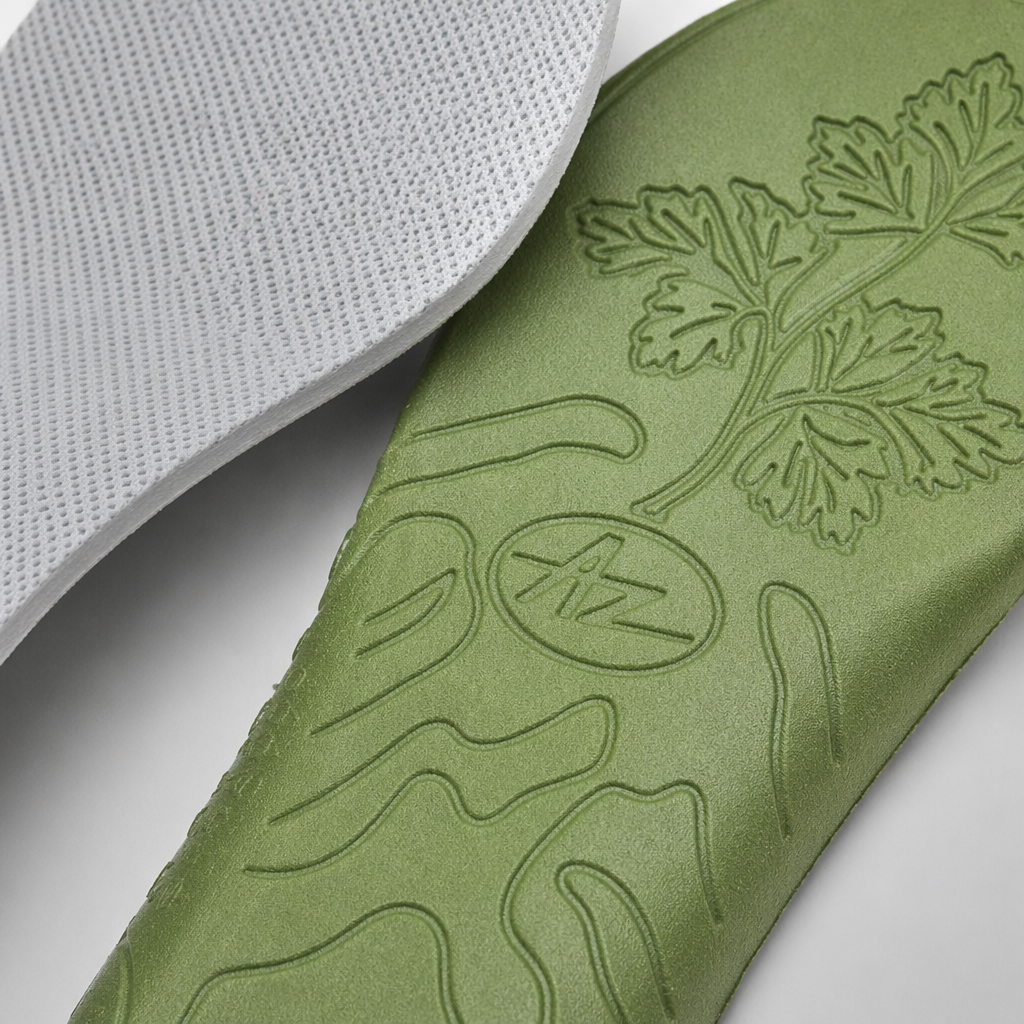 The green insole has a white mesh on the left and an olive green leaf-shaped AZ logo on the right Application Scenario