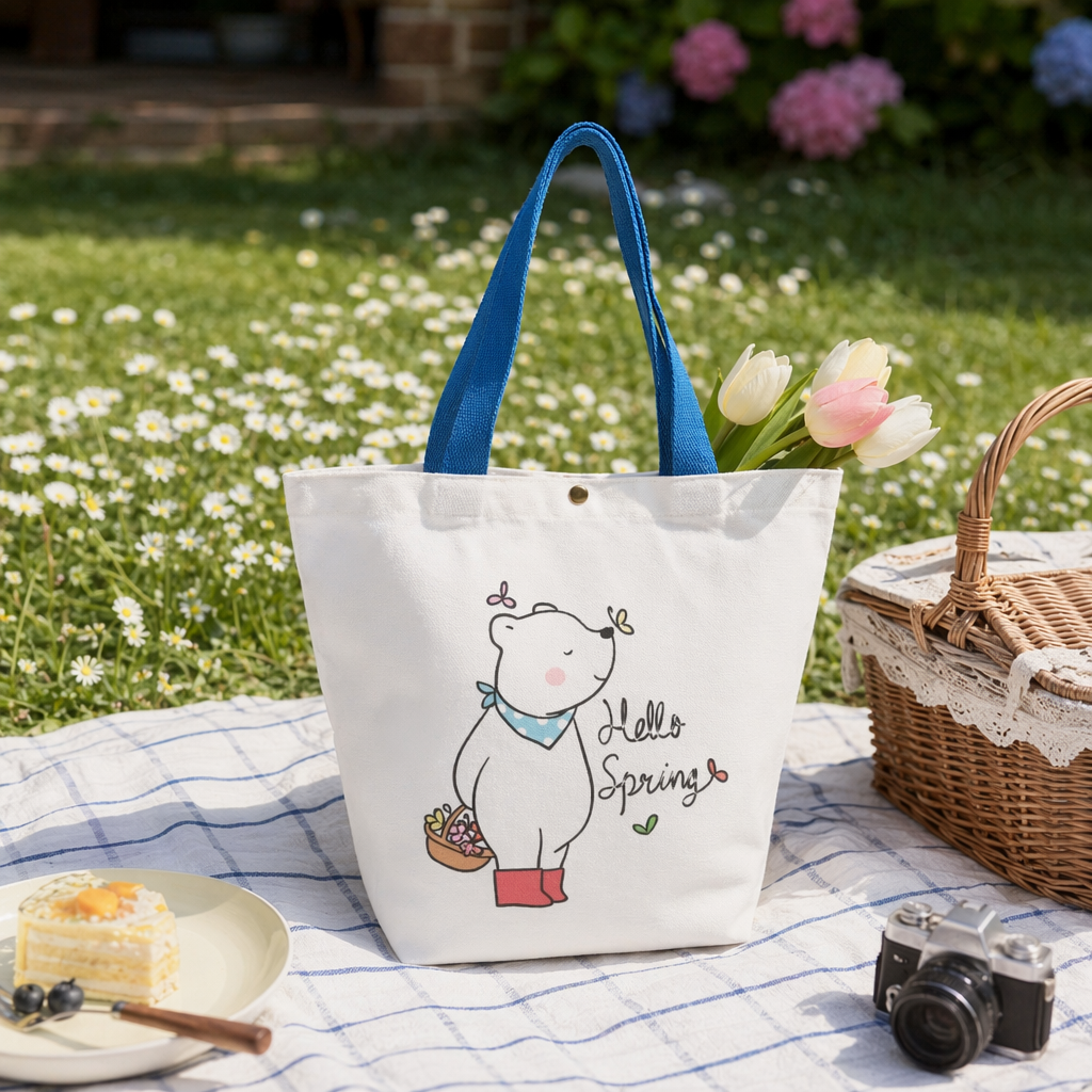 A simple and versatile white canvas bag with a cartoon bear pattern details Picture