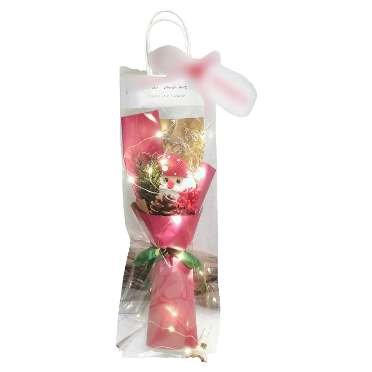 Pink packaged bouquet with snowman doll, pinecone, red berries, dried flowers, transparent bag, green ribbon and warm-colored string of lights Item Picture