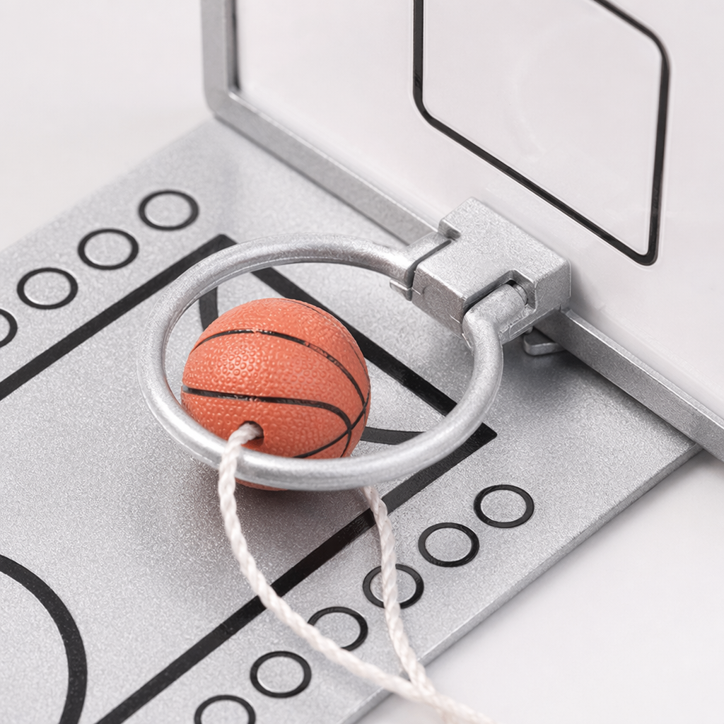 Silver desktop mini basketball stand with orange small balls and transparent backboard for home, office and entertainment Application Scenario