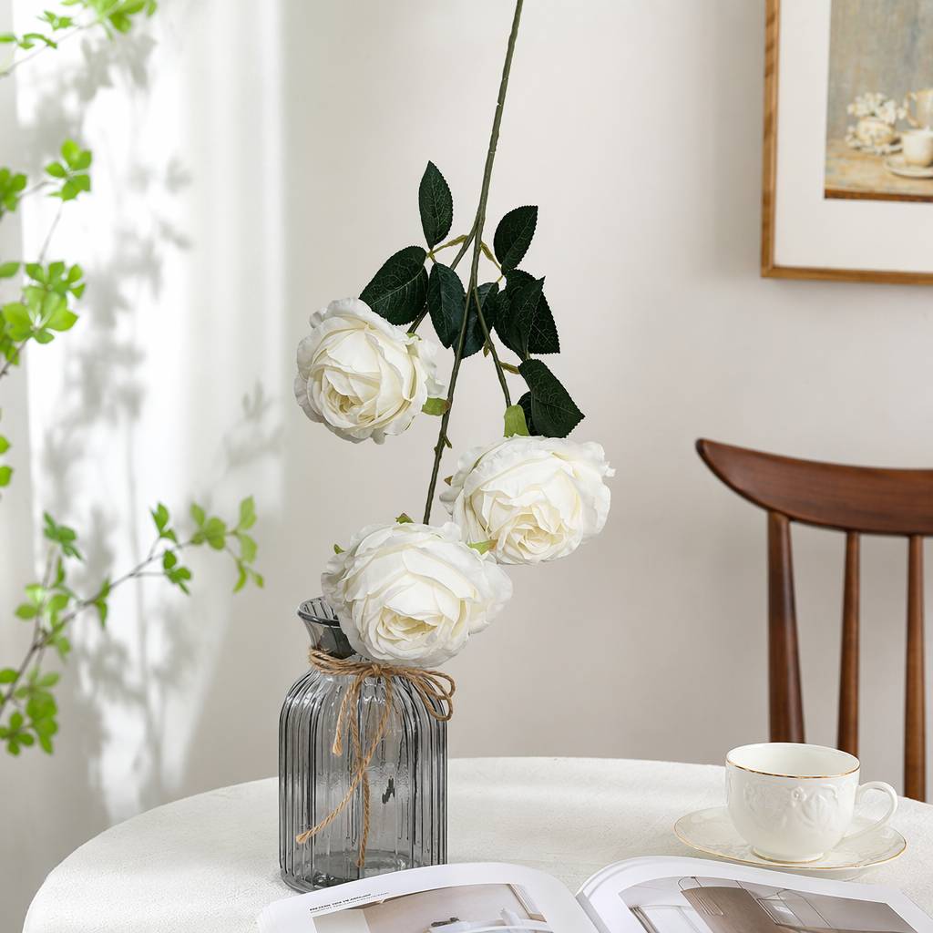 A white artificial rose bouquet simulating preserved flowers for wedding decoration and living room ornaments details Picture
