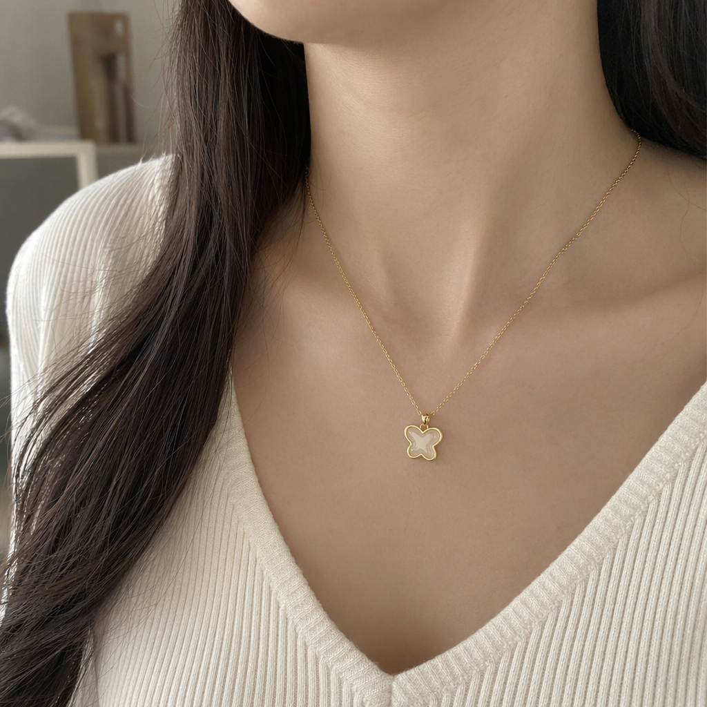 The golden butterfly pendant necklace is wrapped in a white card and sealed in a transparent plastic bag details Picture
