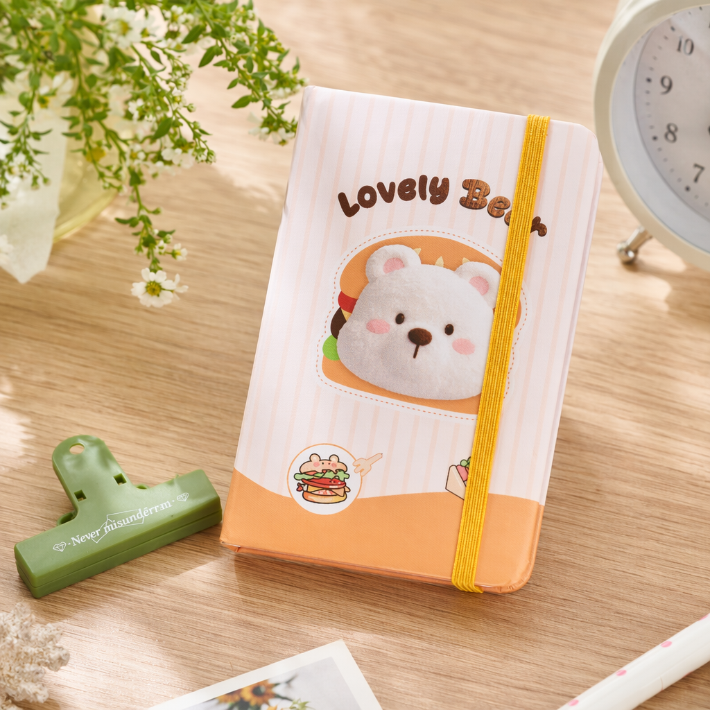 A simple student notebook with a striped cover and a bear pattern details Picture