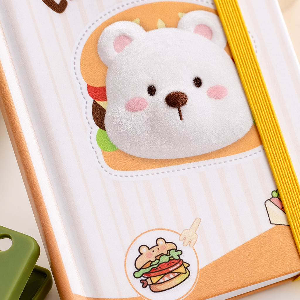 A simple student notebook with a striped cover and a bear pattern Application Scenario