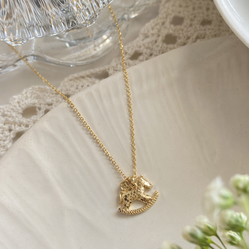 The golden rocking wooden horse pendant necklace is a fashionable, retro and light luxury accessory for girls details Picture