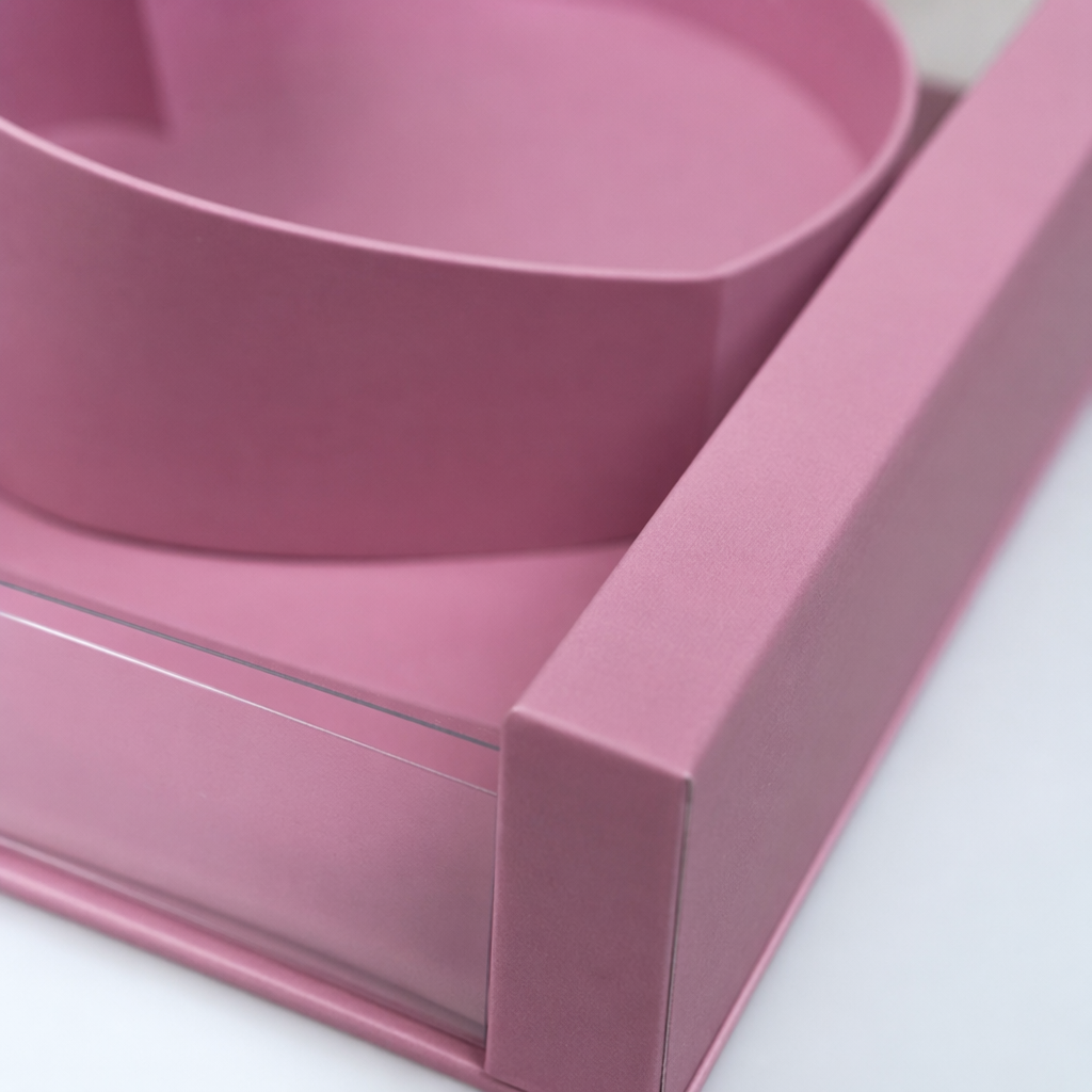 Pink heart-shaped gift box with candies and chocolates for Valentine's Day and birthdays Application Scenario