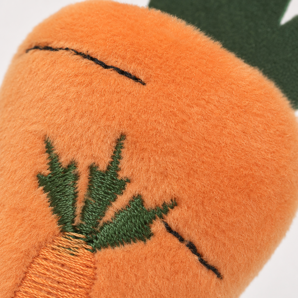 A cute cartoon plush toy in the shape of an orange carrot as a decorative item Application Scenario