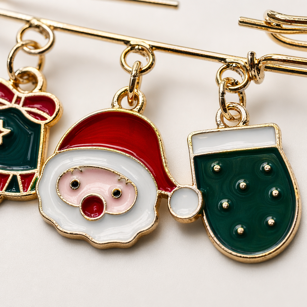Three pendants with golden Christmas-themed brooches, bells and Santa Claus gloves Application Scenario