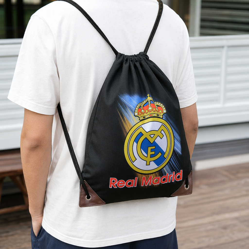 شعار فريق ريال مدريد الأسود الذي يحمل حقائب اليد، وكلمة "ريال مدريد" details Picture
