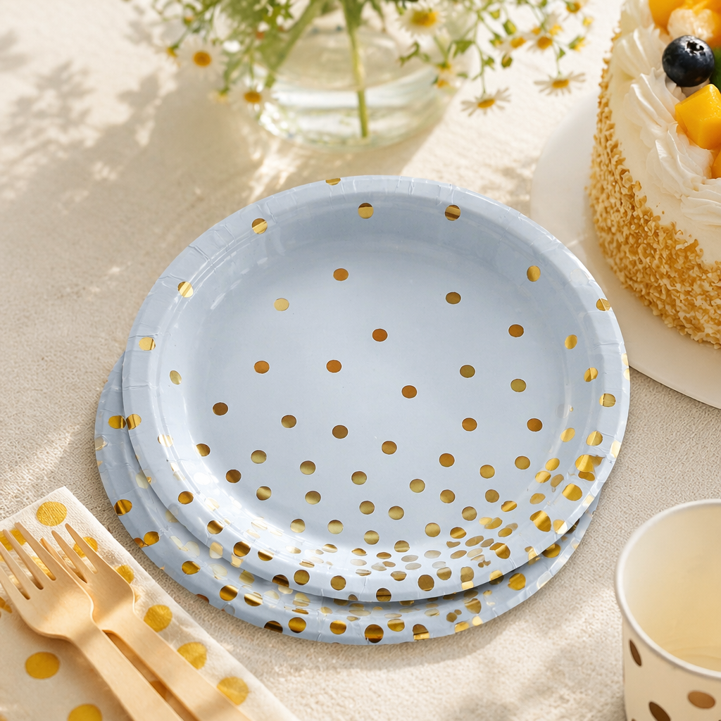 A disposable paper plate in light blue with golden dots for banquet and party decoration details Picture