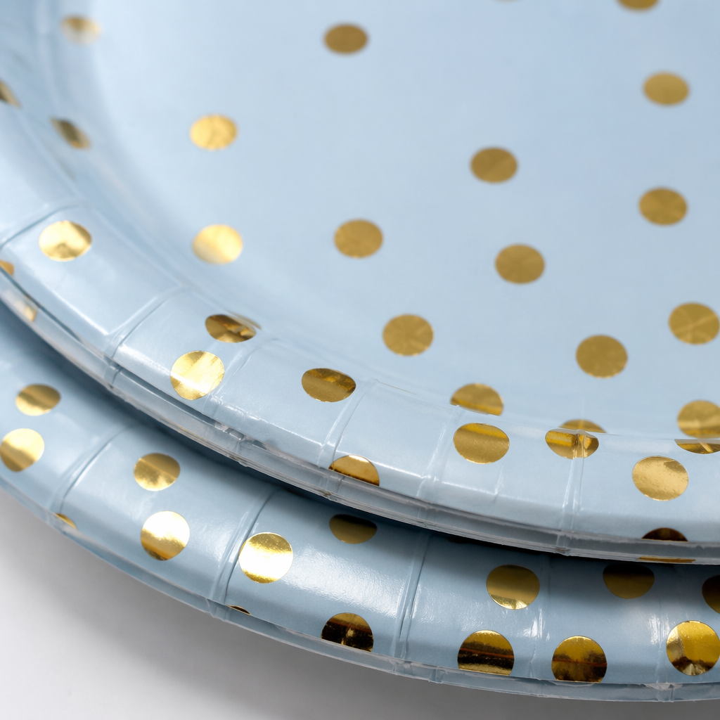 A disposable paper plate in light blue with golden dots for banquet and party decoration Application Scenario