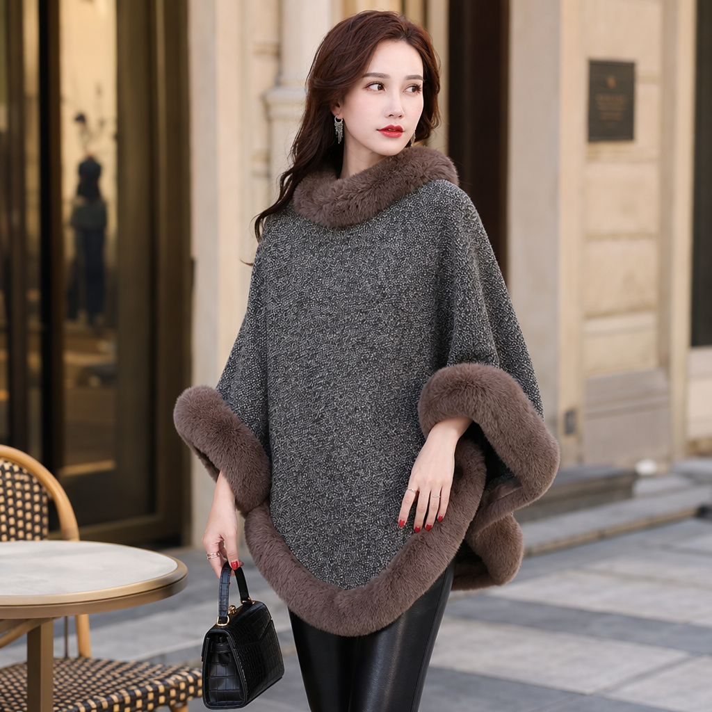 A real photo of a female model with a grey woolen cape and a brown fox fur leader's mouth details Picture