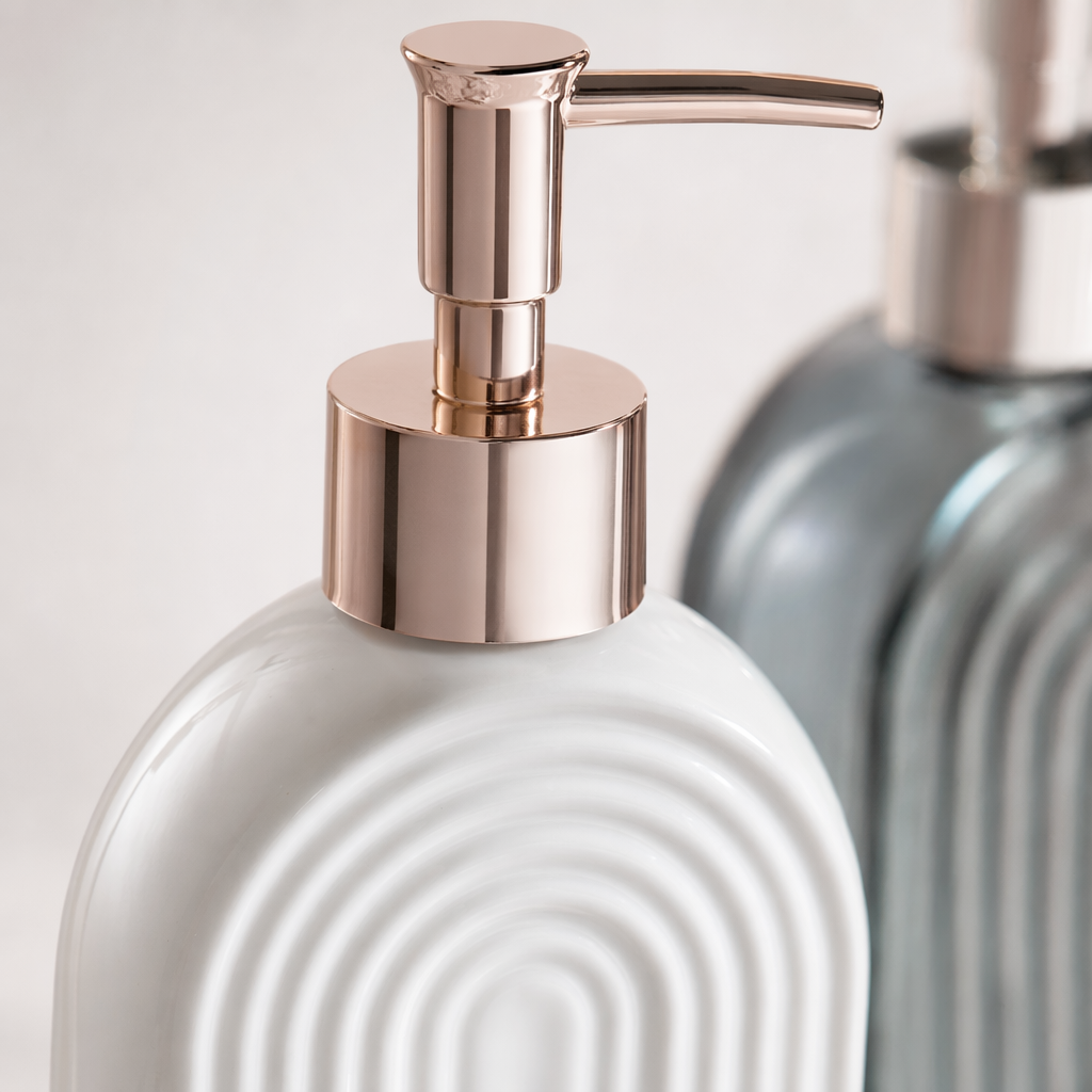 A set of home aromatherapy storage containers featuring a white arc-shaped texture press bottle and a grey glass press bottle Application Scenario