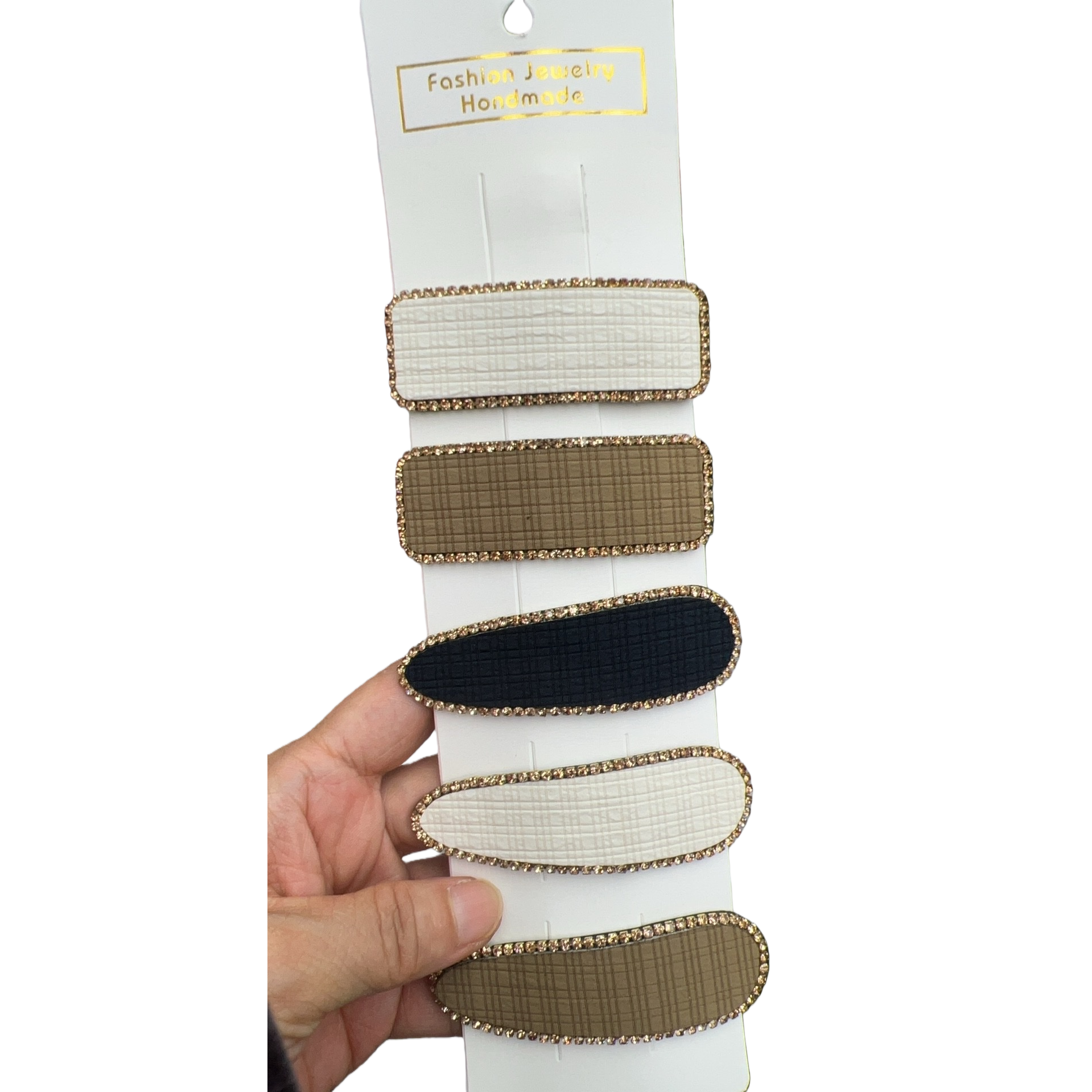 Five rectangular and oval-shaped hair clips with golden diamond-encrusted checkered patterns are handheld for display Item Picture
