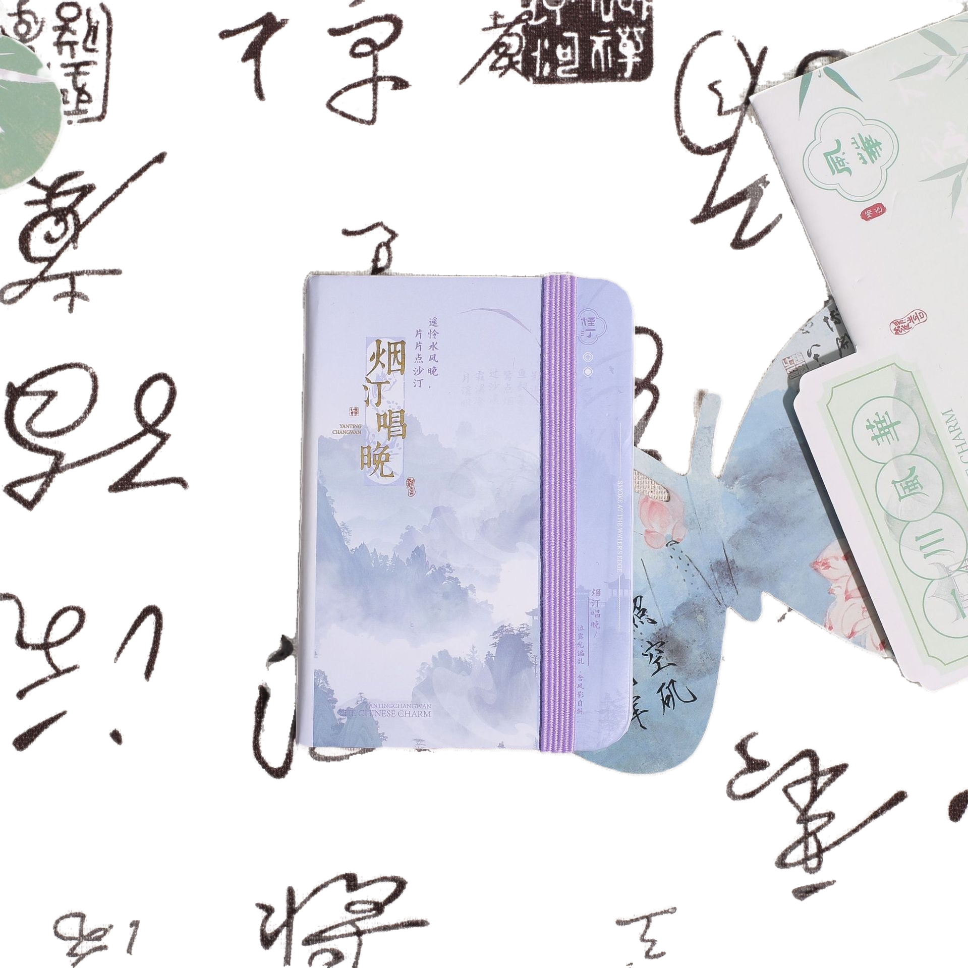 The light purple strap-tied notebook features an ink-wash landscape painting cover with a calligraphy background Item Picture