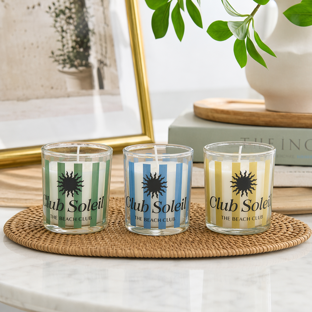 Club Soleil Three striped glass cup scented candles with green, white, blue, white, yellow and white sun patterns details Picture