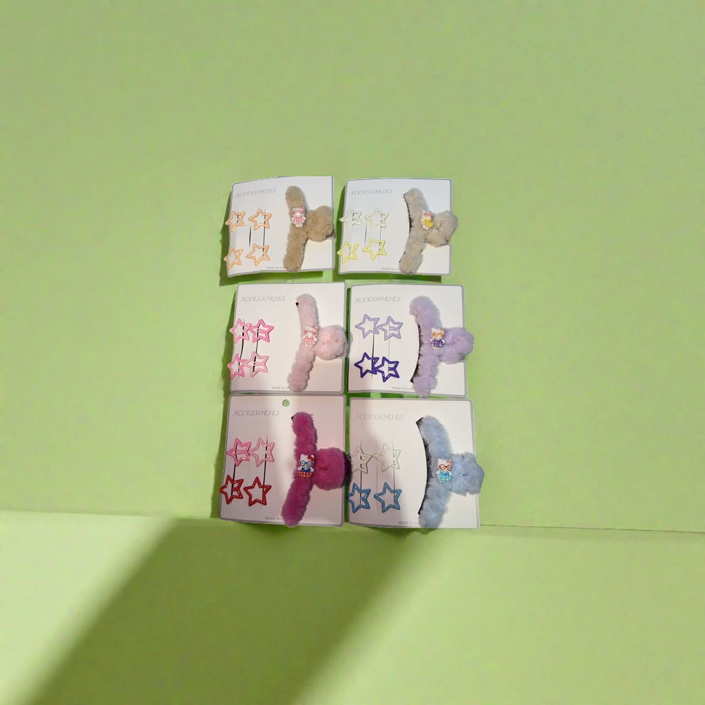 A combination of colorful star hair clips and plush Hello Kitty hair accessories