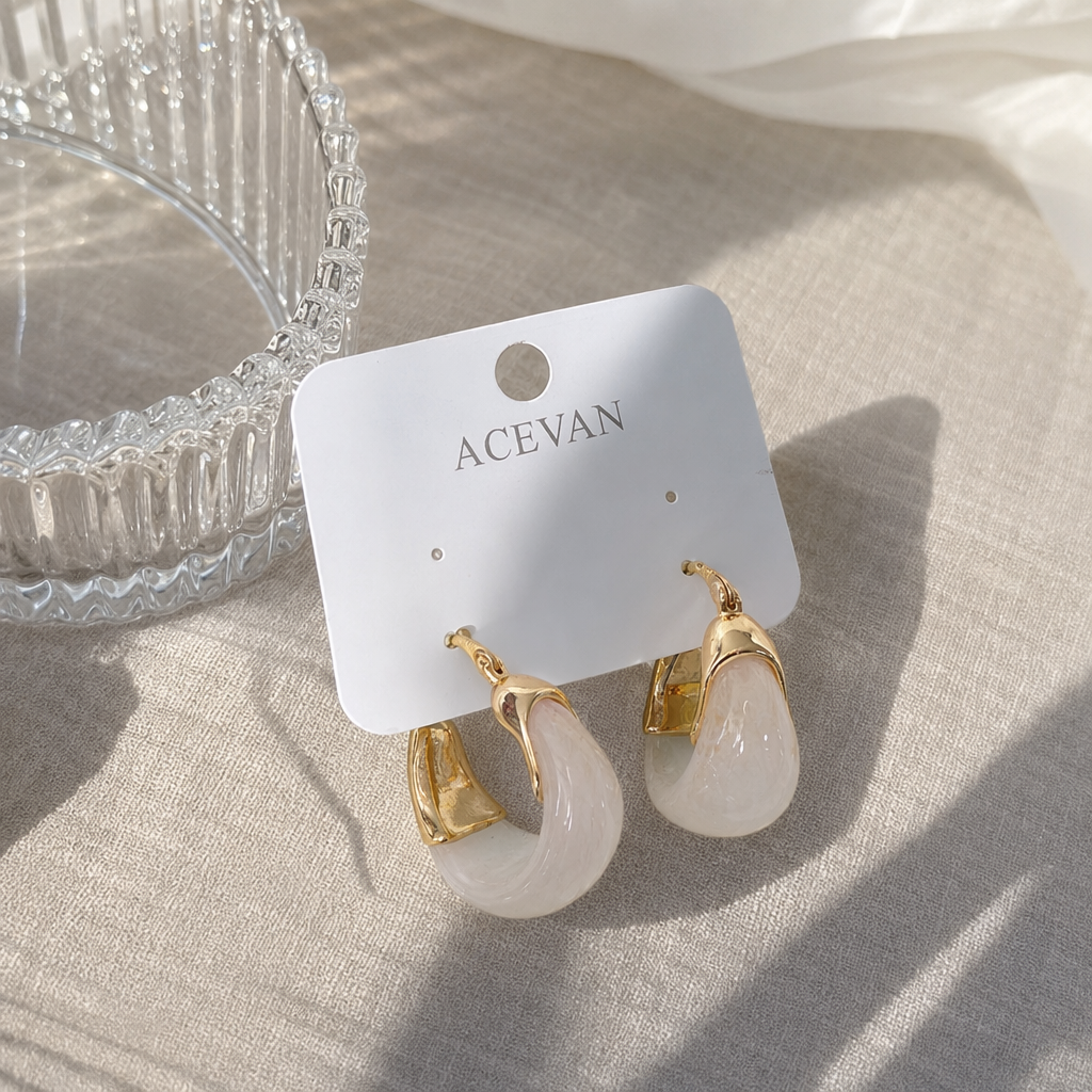 The golden earrings with pink and white gradient beads feature a light luxury design that is versatile and fashionable for women details Picture