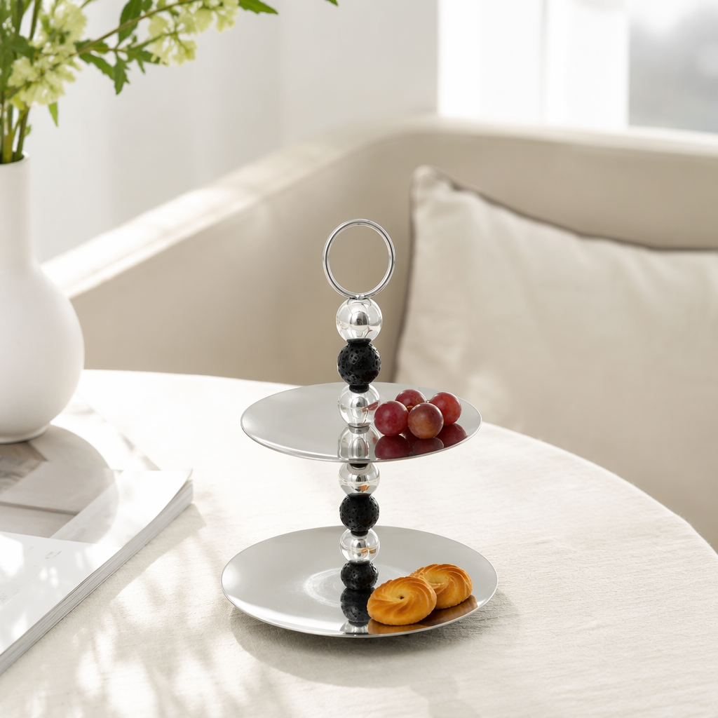 A silver double-layer tray with a circular handle made of black and white beads details Picture