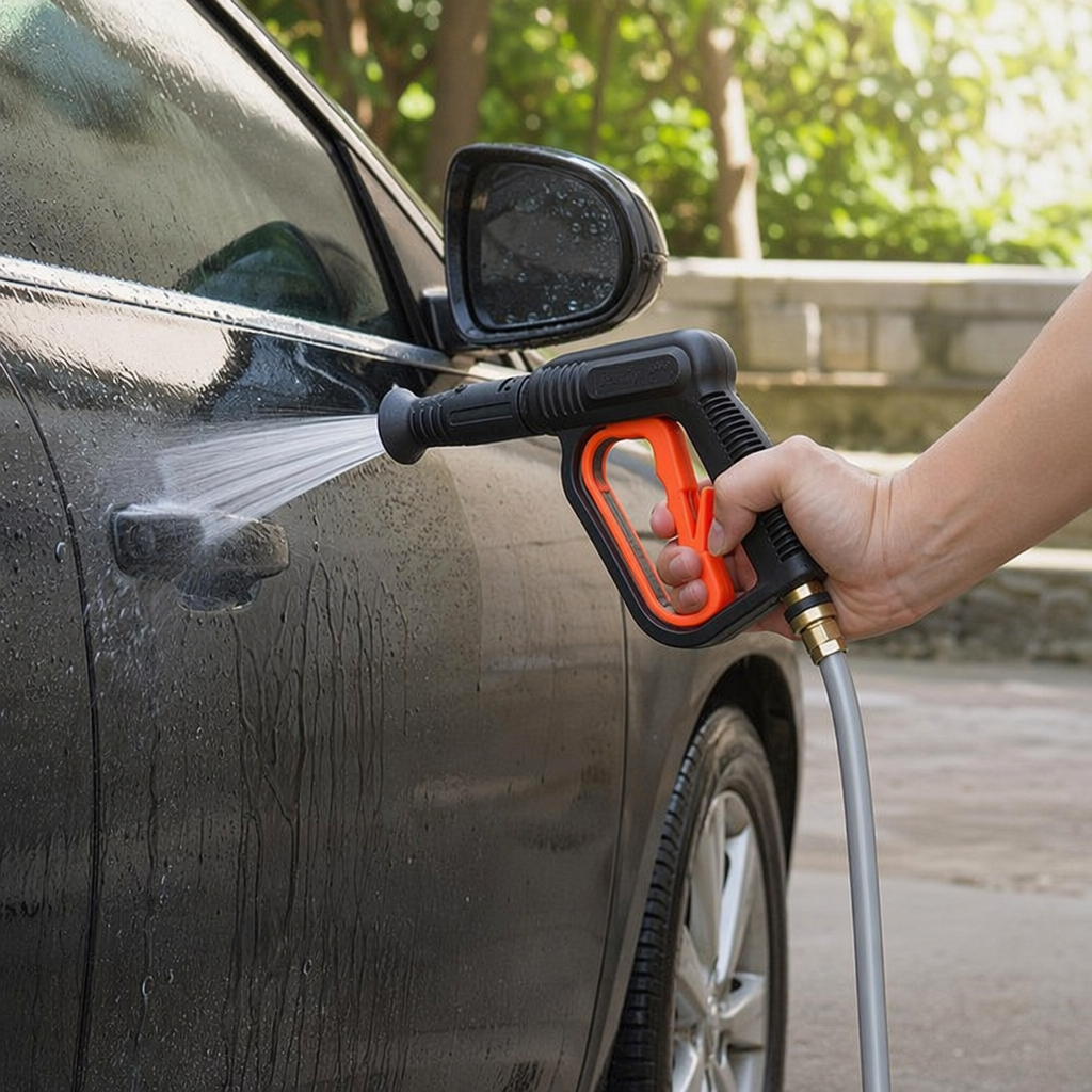 A portable household powerful cleaning device with a black high-pressure water gun and an orange trigger details Picture