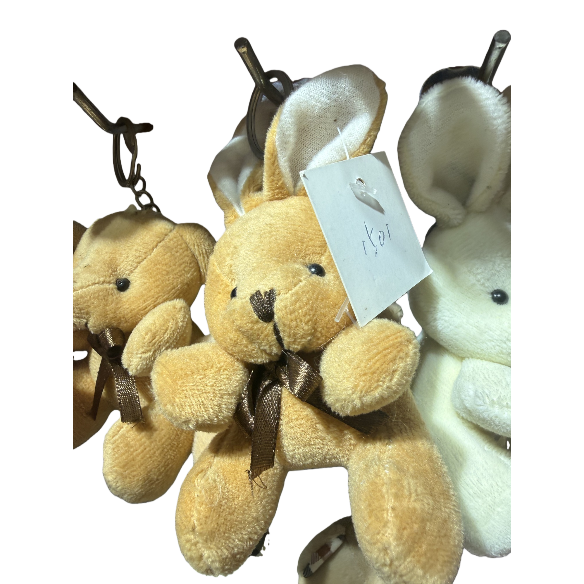 The yellow plush bear pendant is cute and adorable. The keychain bag is decorated with plush toys Item Picture