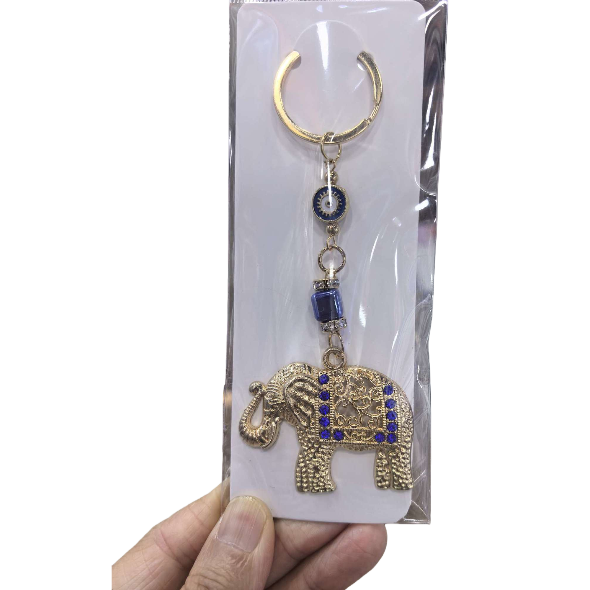 Llavero en forma de elefante dorado adornado con gemas azules con colgante de mal ojo Item Picture
