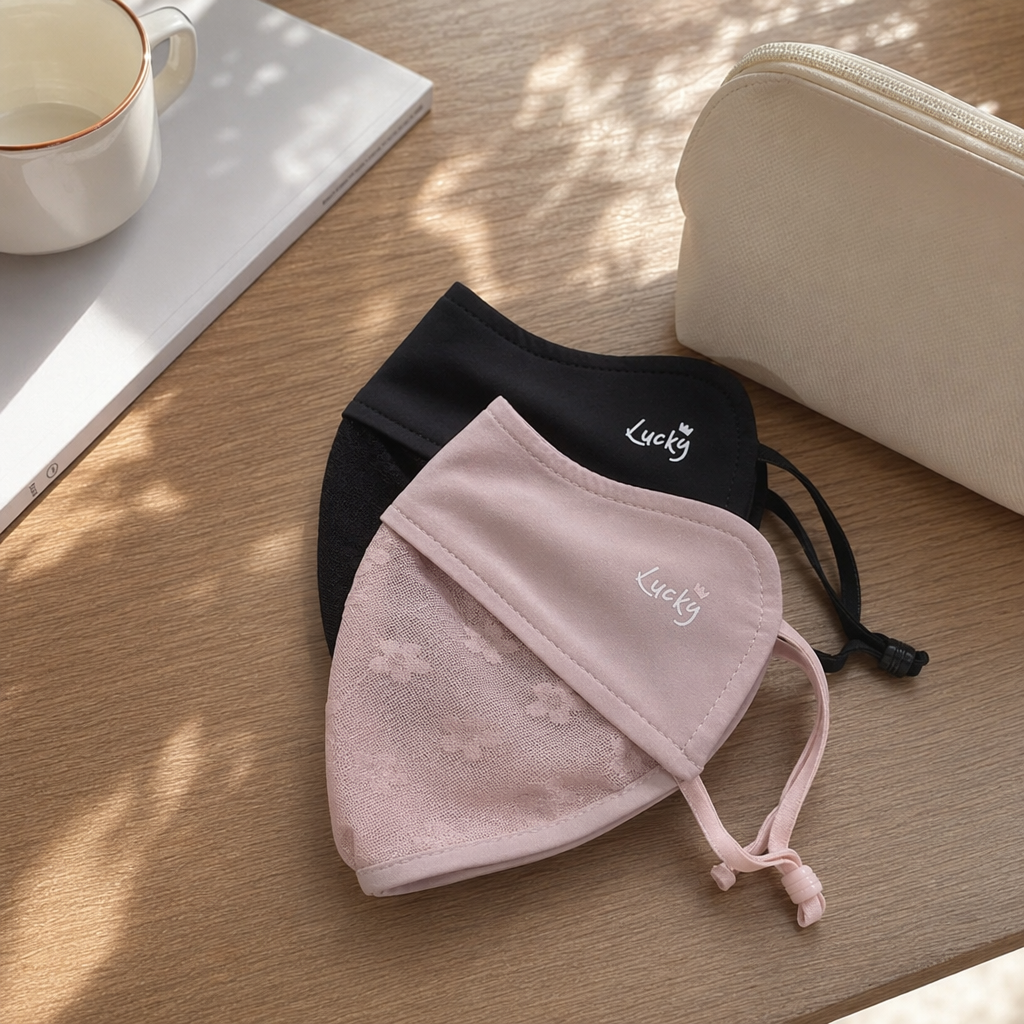 Holding a pink and black lace patchwork ice-feel sun protection breathable mask details Picture