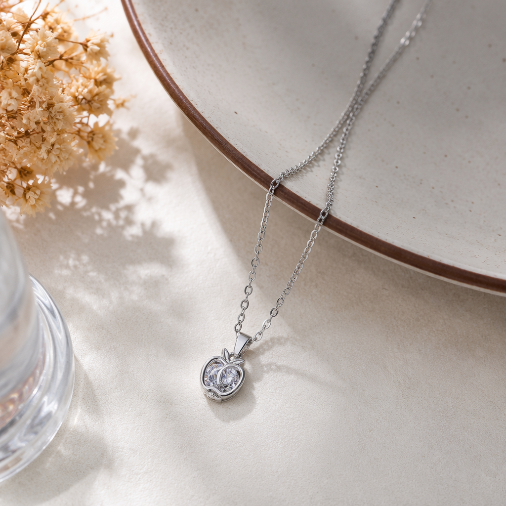The silver apple pendant necklace is a simple and fashionable accessory for women details Picture