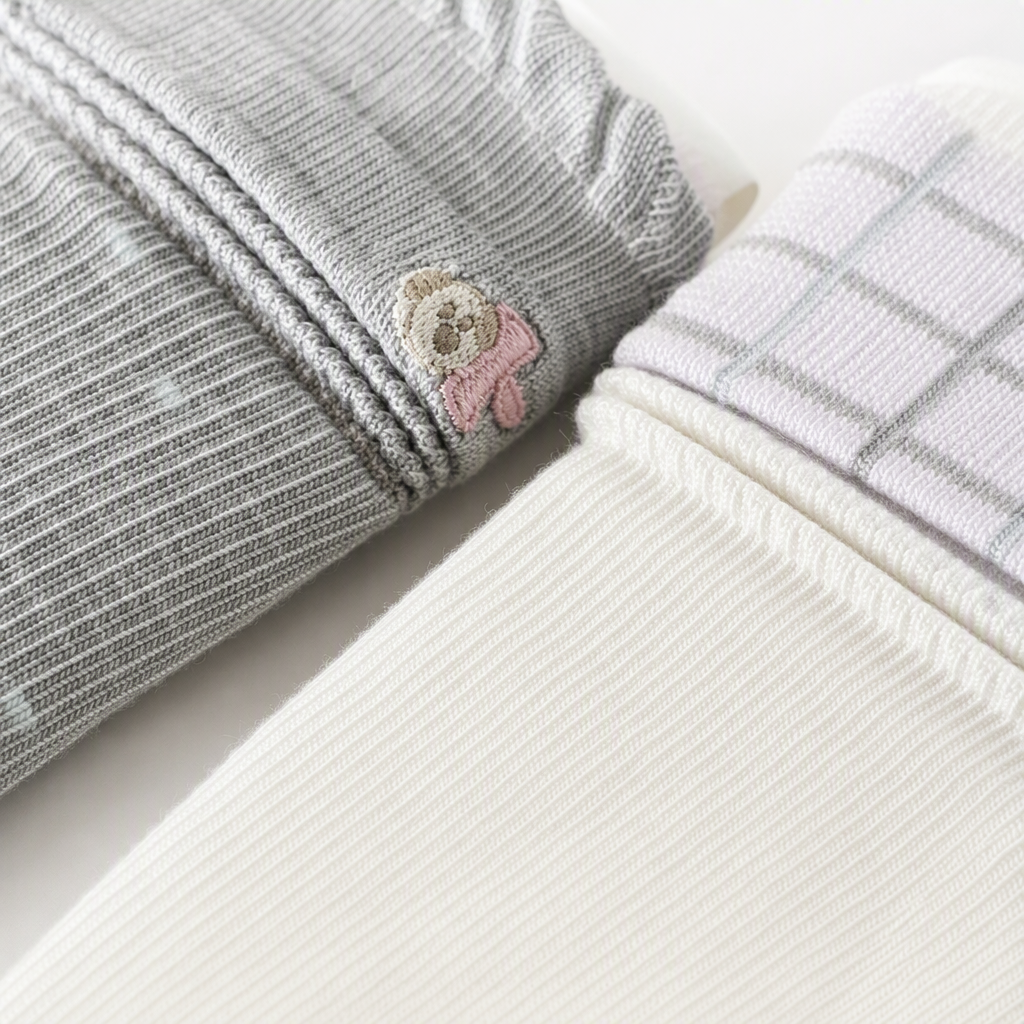Two pairs of grey striped and white checkered stockings are stacked and released Application Scenario