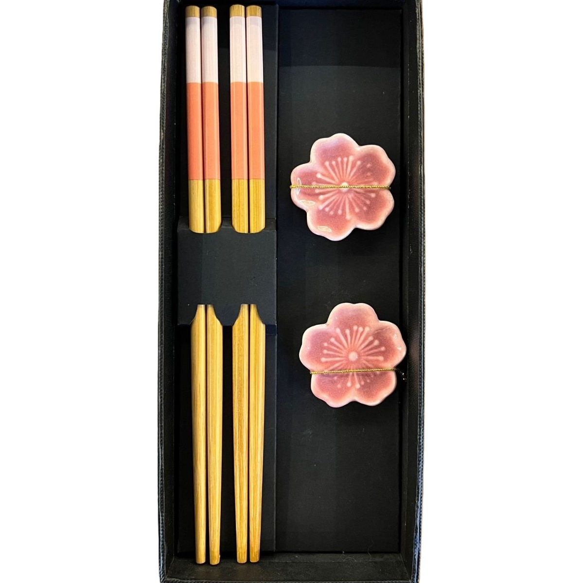 Two pairs of chopsticks in a black gift box, in the shape of cherry blossoms. The pillowcase is made of bamboo with a gradient of pink and orange. The pure bamboo design is exquisite and practical Item Picture