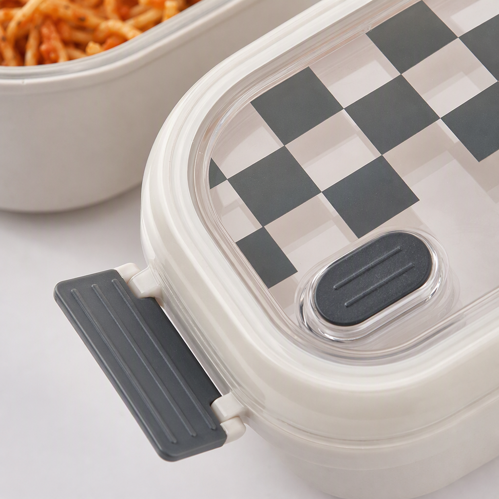 The white stainless steel insulated lunch box with a transparent lid and a checkerboard design contains a portable pasta and salad box Application Scenario