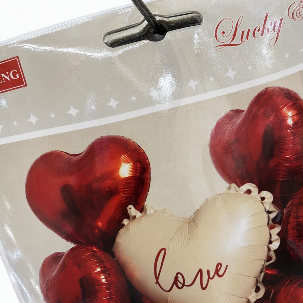 Beige heart-shaped balloons with the word "love" and red heart-shaped balloons are used to decorate the party atmosphere items Application Scenario