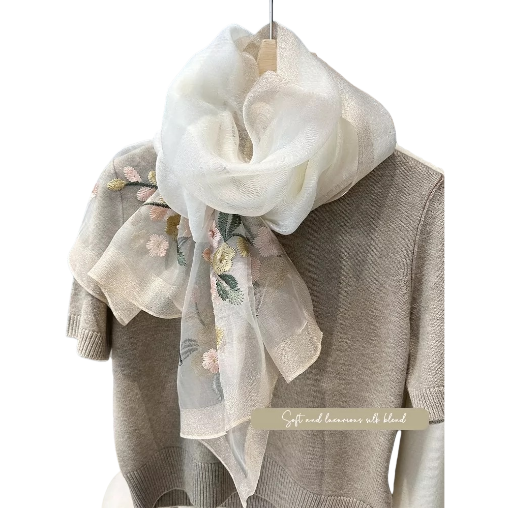 A colorful embroidered floral silk scarf paired with a beige knitted sweater is an elegant, versatile, soft, light and fashionable accessory Item Picture
