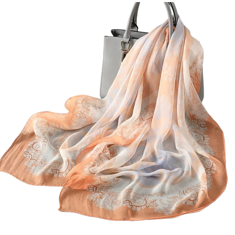 The fashionable and versatile orange and white patterned silk scarf is soft and light. The new spring and summer women's shawl accessory is trendy and versatile Item Picture