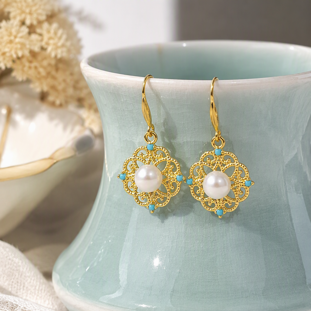 Fashionable gold and silver pearl earrings, four pendants, blue gemstones with hollowed-out patterns, elegant earrings, and white label decoration details Picture
