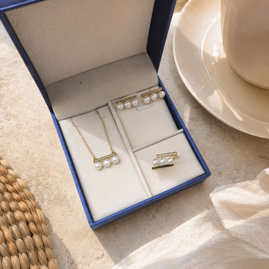 Blue jewelry box, pearl three-piece set, necklace, stud rings, white padding, elegant accessories, gift box packaging details Picture