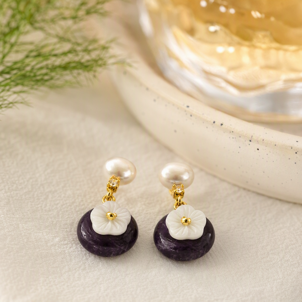 The purple and white flower pearl earrings in the white jewelry box are fashionable, elegant and versatile, making them an excellent gift details Picture