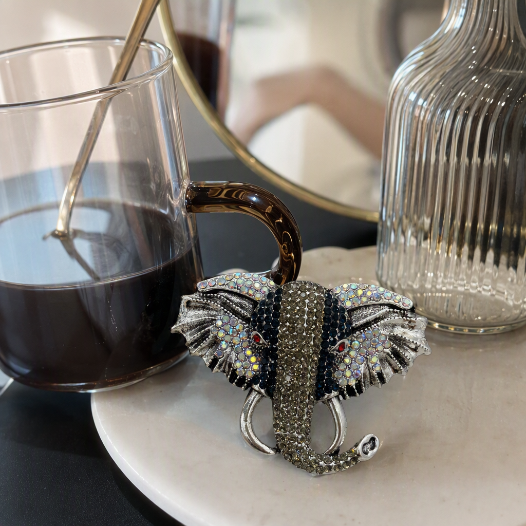A silver diamond-encrusted elephant-shaped brooch is a fashionable, versatile and unique ladies' accessory and gift collection details Picture