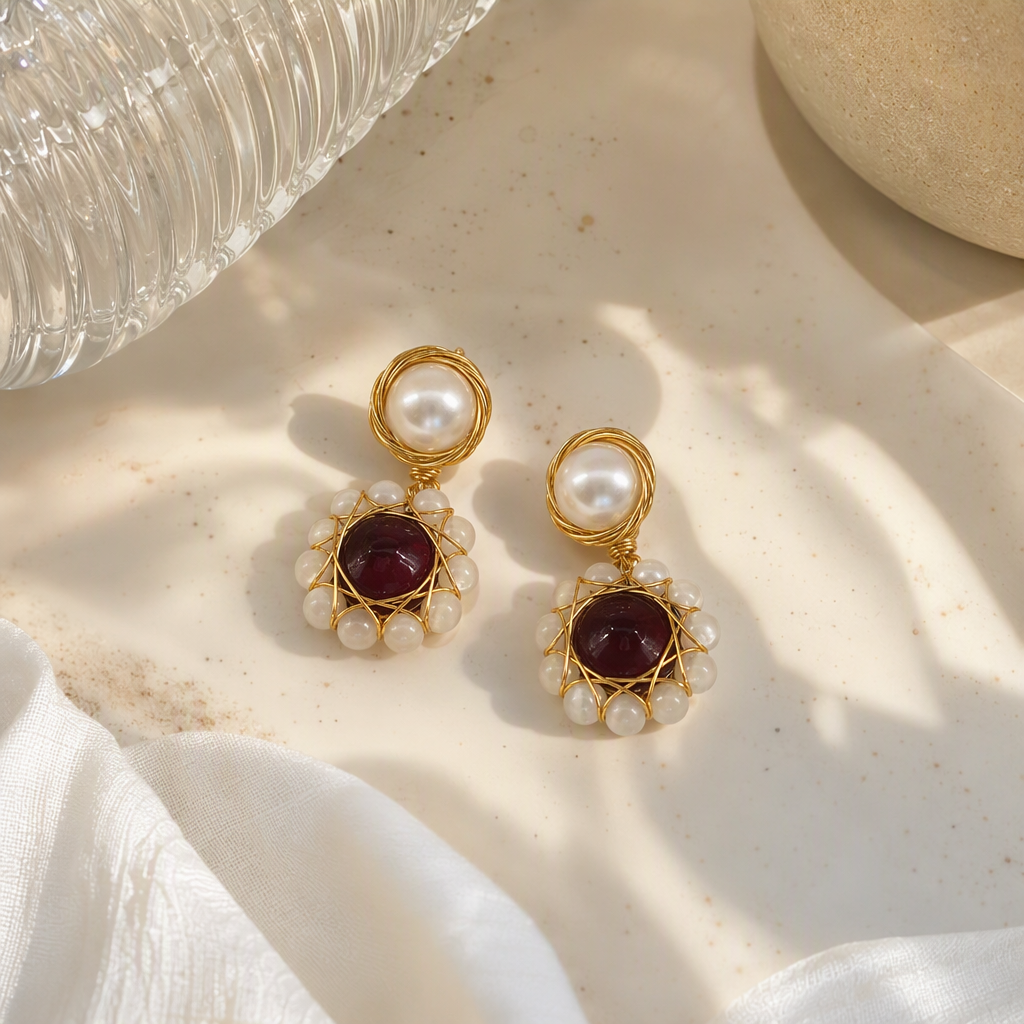 White jewelry box with golden pearl and ruby earrings. Fashionable and elegant accessories. Women's gift box packaging details Picture
