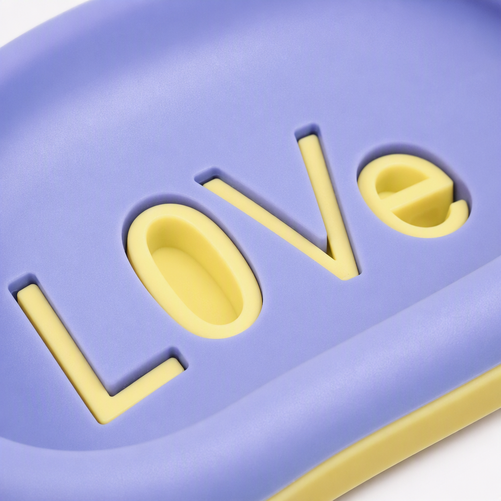 The purple oval soap box with the three-dimensional "LOVE" yellow characters on its surface is a simple and creative hand soap storage box for household items Application Scenario