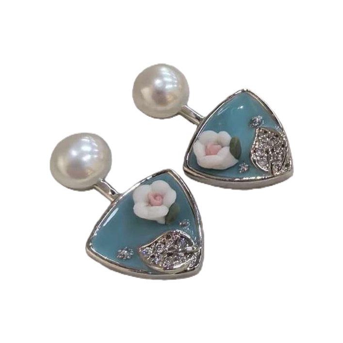 The blue background with white flower pearl stud earrings in the white jewelry box are simple, elegant and elegant earrings for women Item Picture