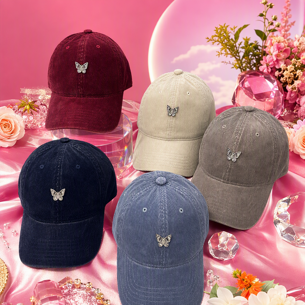Five colorful corduroy baseball caps, silver butterfly badges, casual and trendy men's and women's designs, and a light grey wood grain floor are on display Specification image